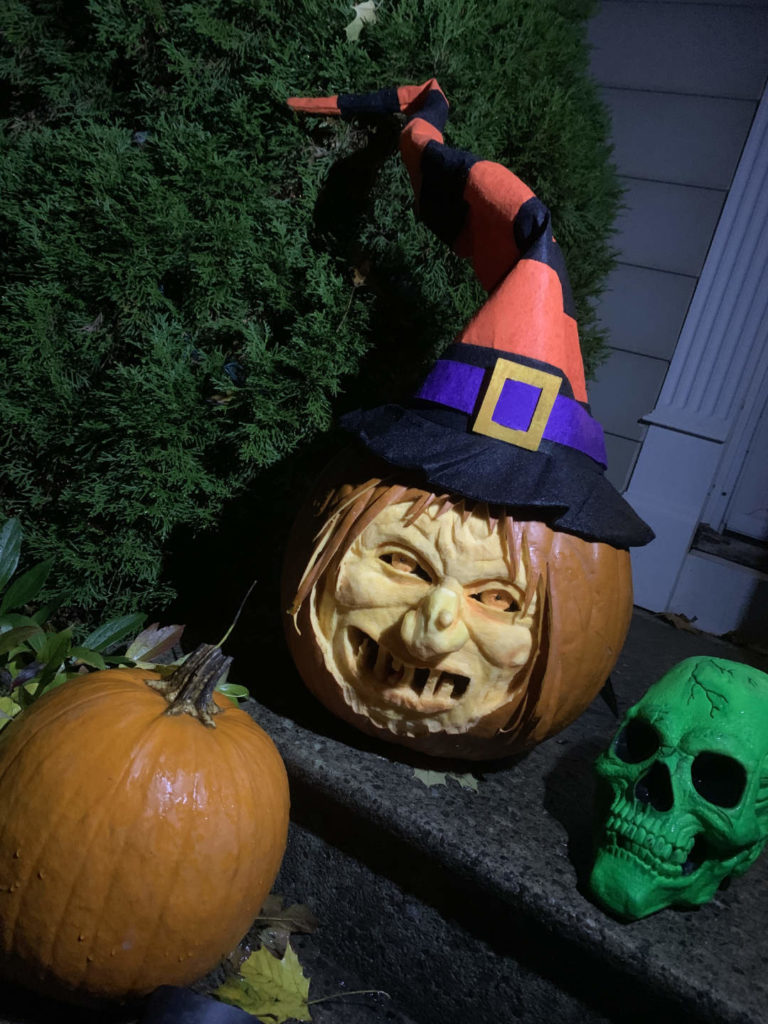Award winning pumpkin carving of a wicked witch for Halloween