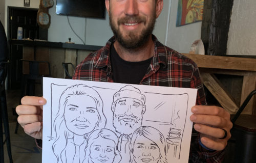 Live caricature drawing of family of four at Culture Days