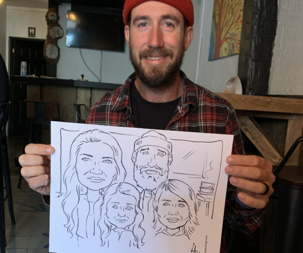 Live caricature drawing of family of four at Culture Days