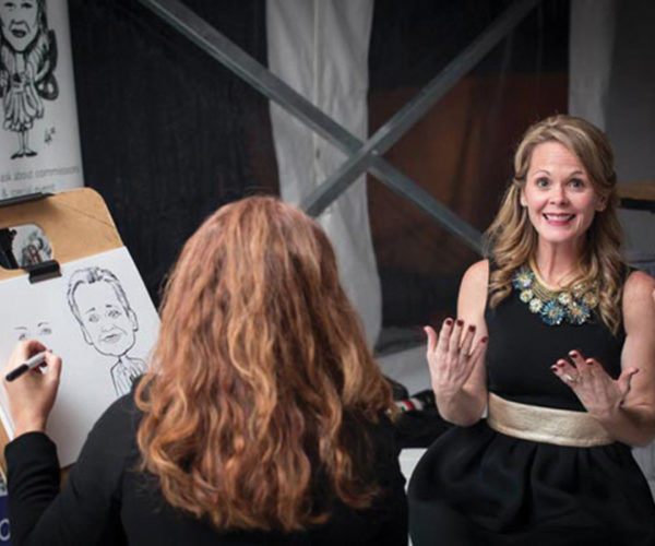 drawin caricatures live at a wedding