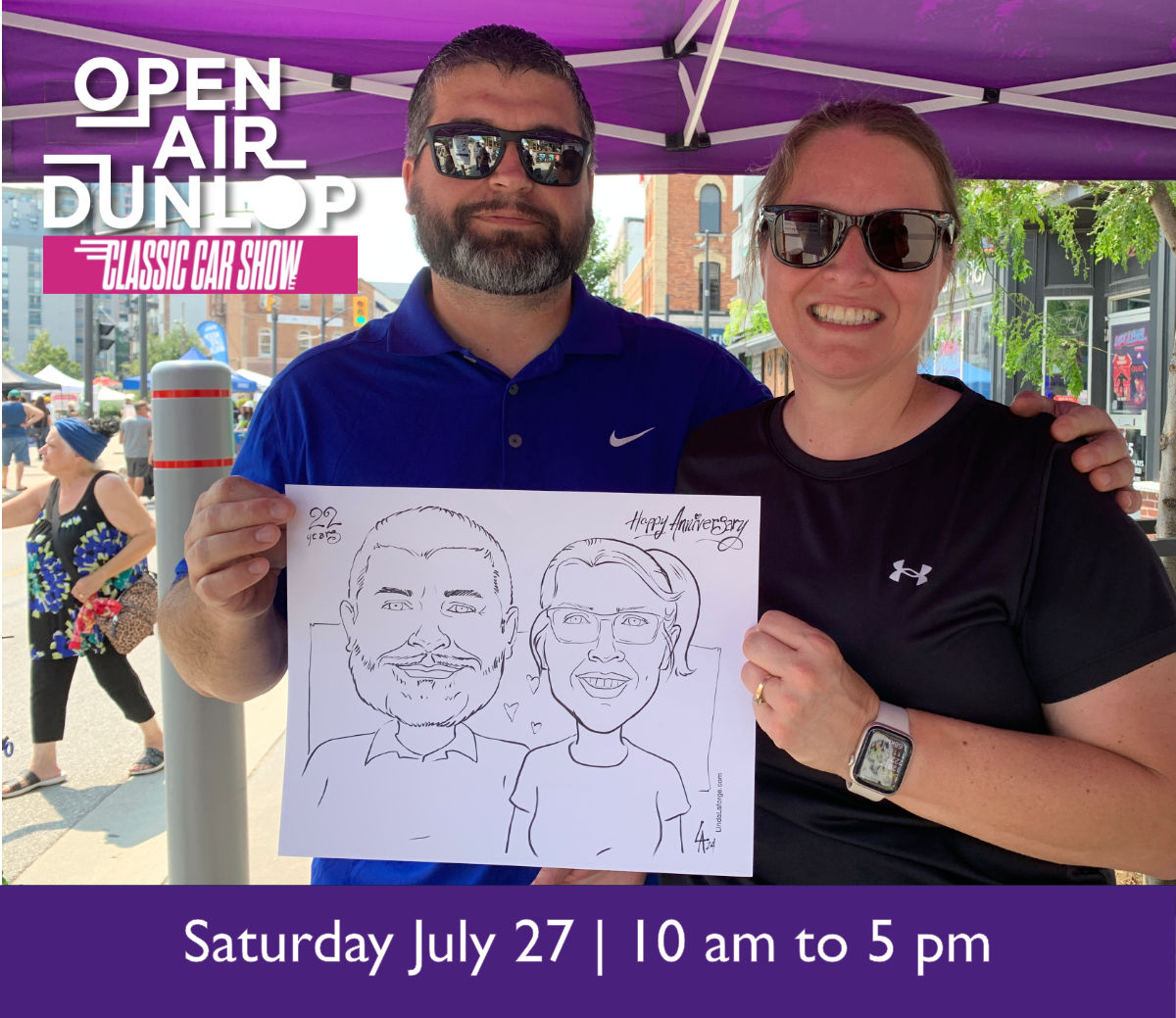Couple holding caricature of themselves at Open Air Dunlop in Barrie