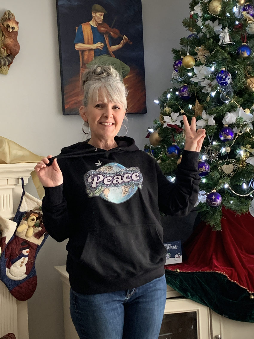 Peace on Earth-hoodie-850 Canadian artist Linda Laforge wearing her Peace on Earth art on a hoodie