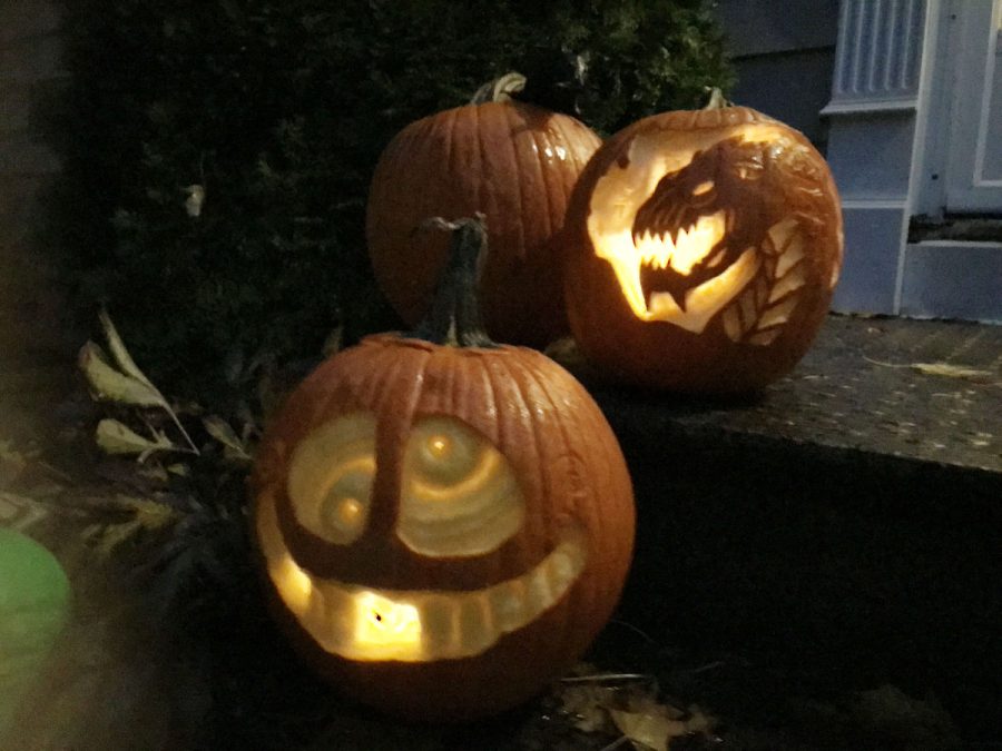 pumpkin etching - dragon and funny face pumpkins outside